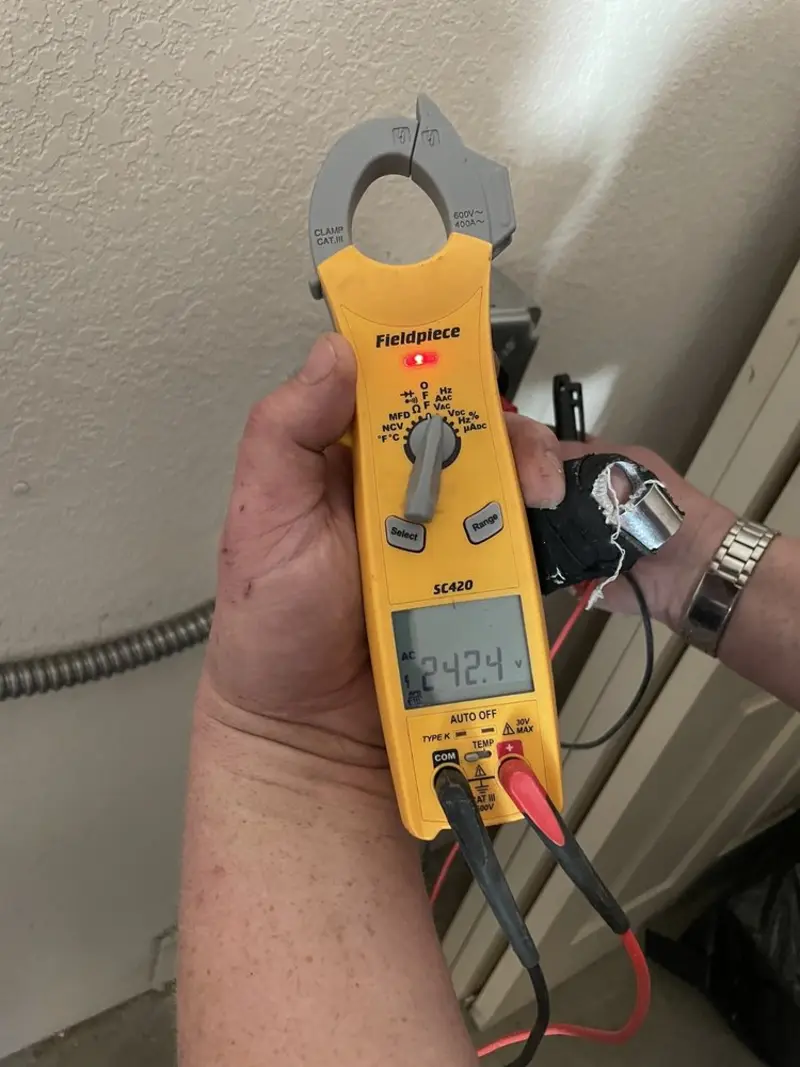 Voltage testing with clamp meter during Recessed Lighting Installation in Odenville